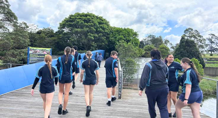 image of a group of students walking in the parklands