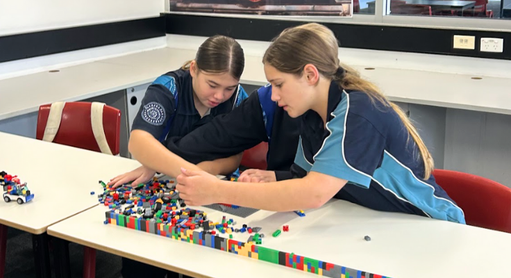 image of Two girls building a lego model in HSIE