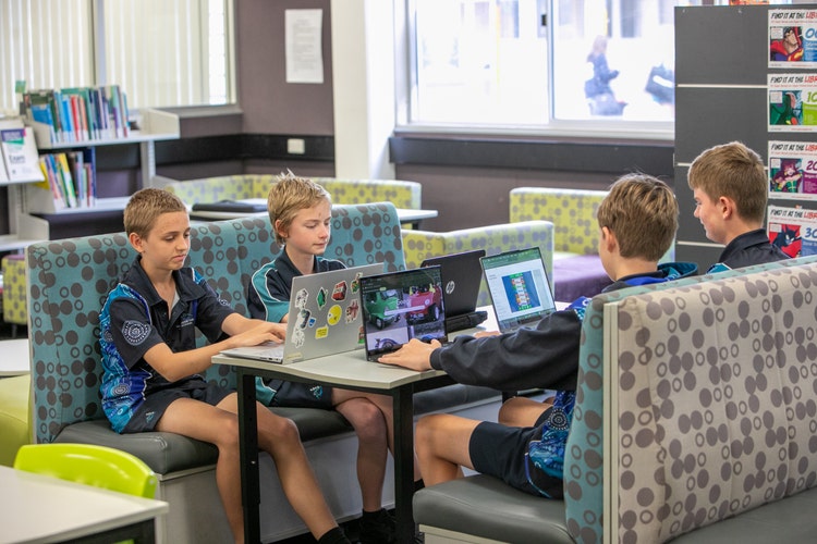 Group of students studying in the library